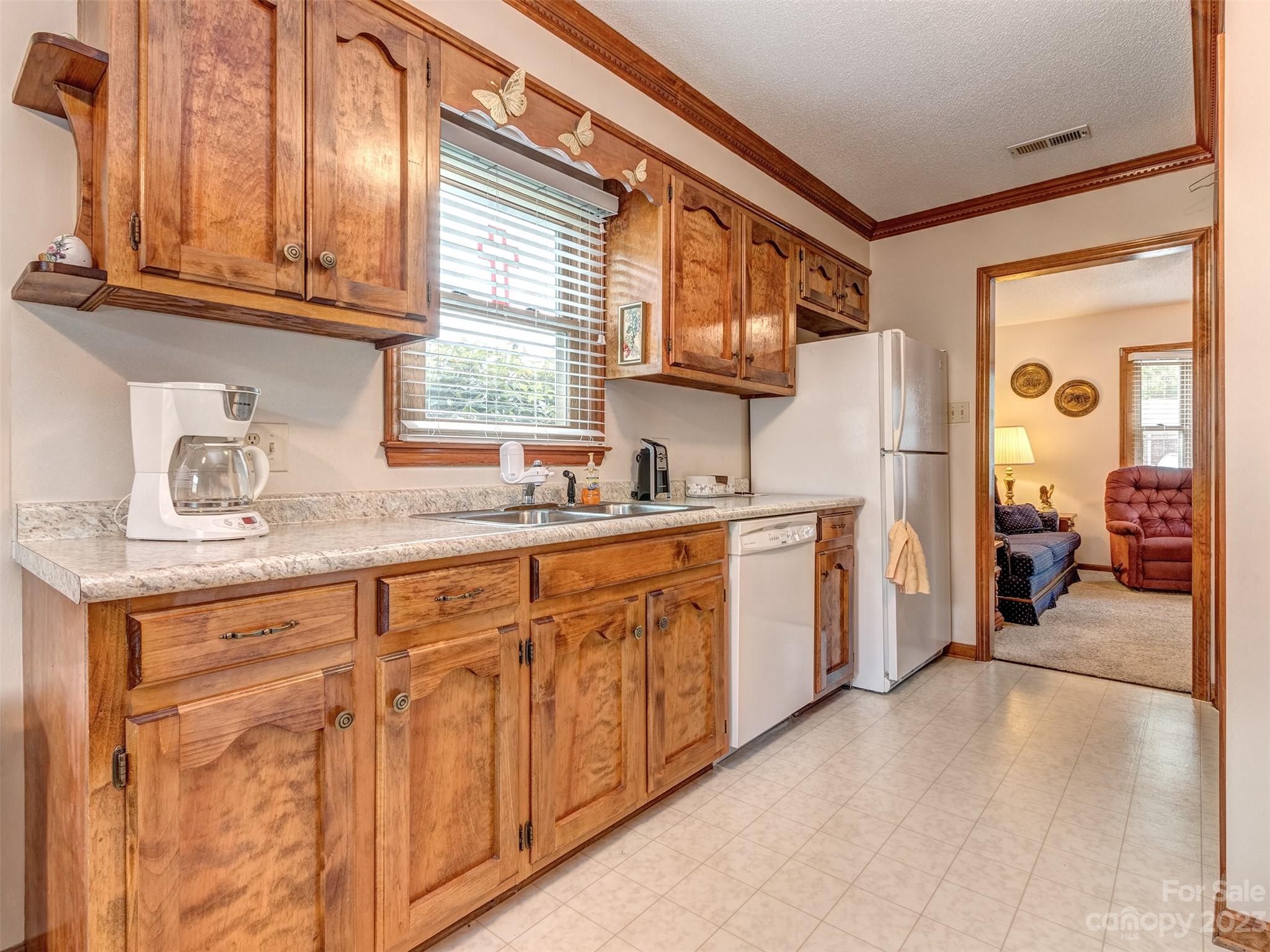 1967 Ebenezer Road Rock Hill, SC 29732 - Photo 11 of 26 a kitchen with granite countertop a sink cabinets stainless steel appliances and a window