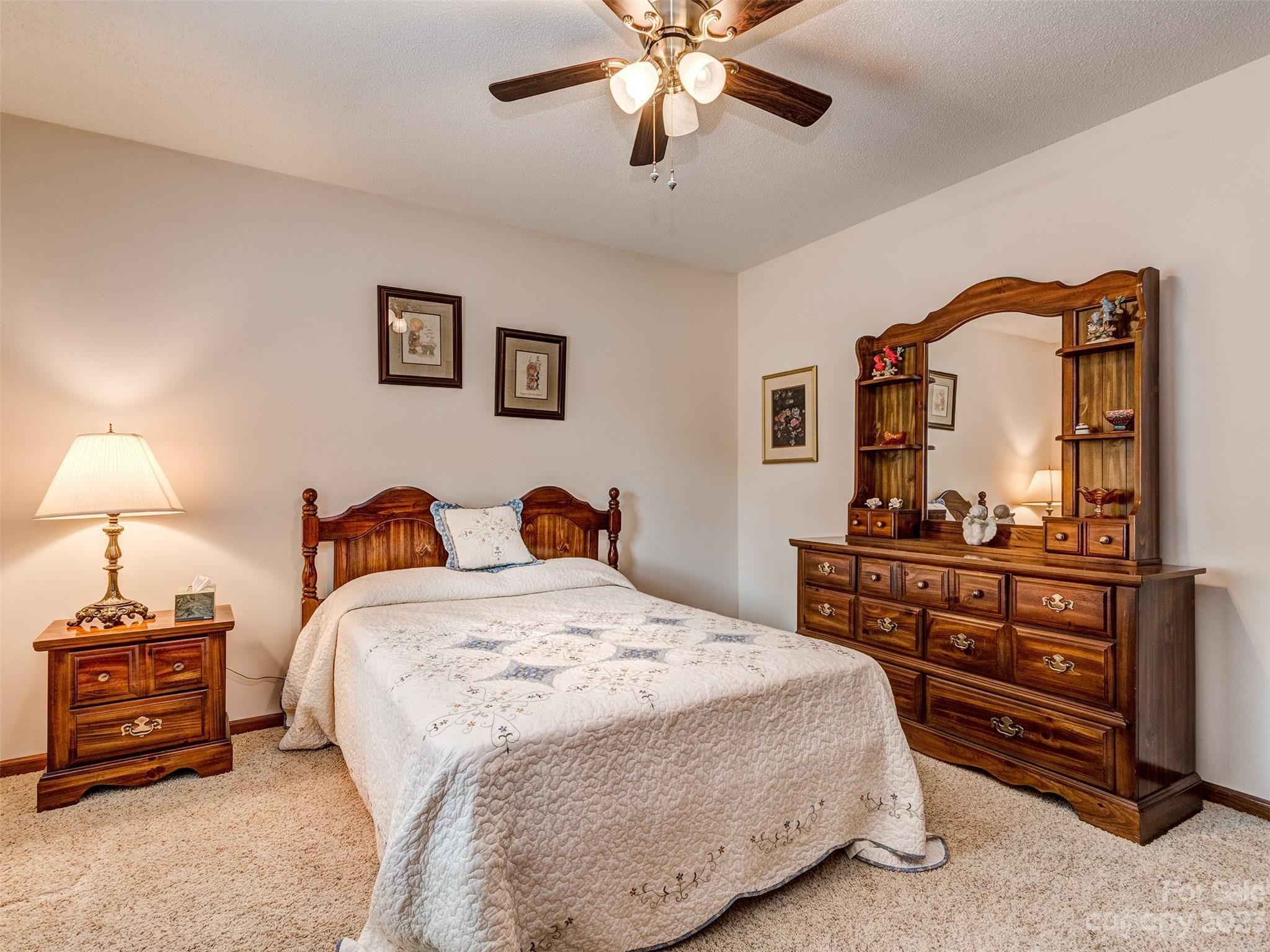 1967 Ebenezer Road Rock Hill, SC 29732 - Photo 21 of 26 a bedroom with a bed and a dresser in it