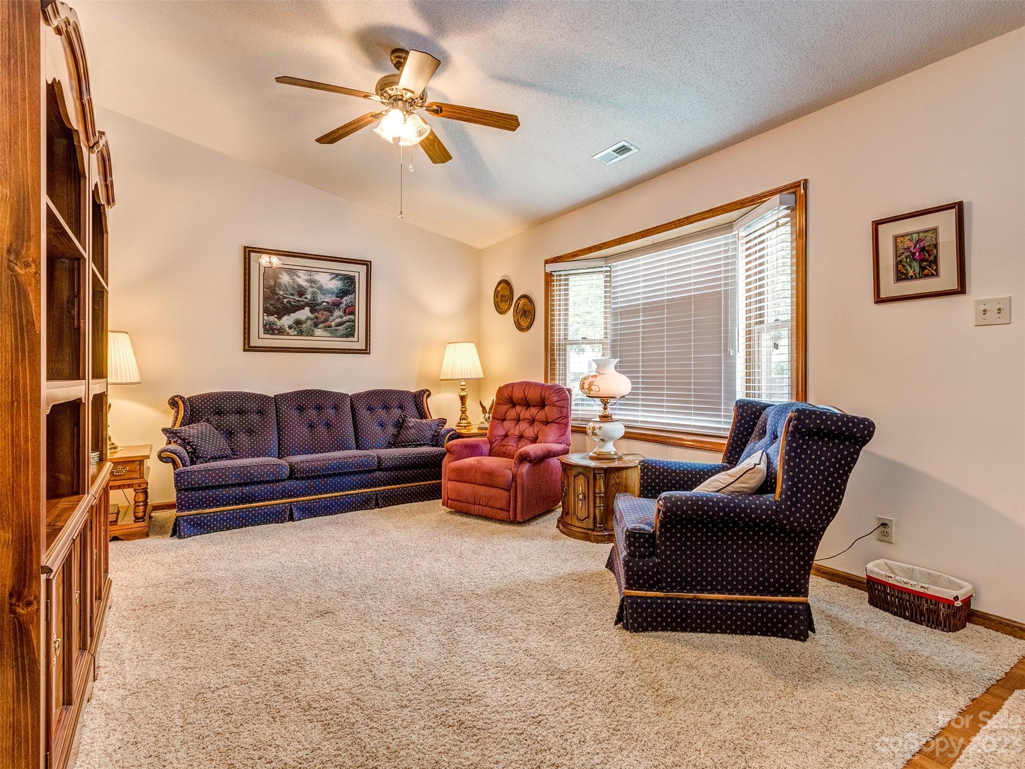 1967 Ebenezer Road Rock Hill, SC 29732 - Photo 9 of 26 a living room with furniture ceiling fan and a window
