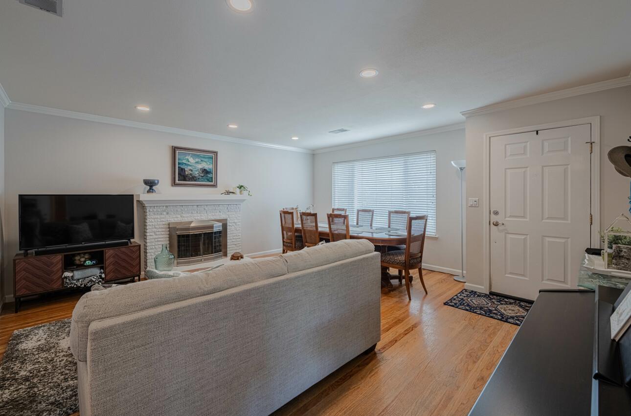 715 Vía Maria Salinas, CA 93901 - Photo 3 of 14 a living room with furniture a fireplace and a flat screen tv