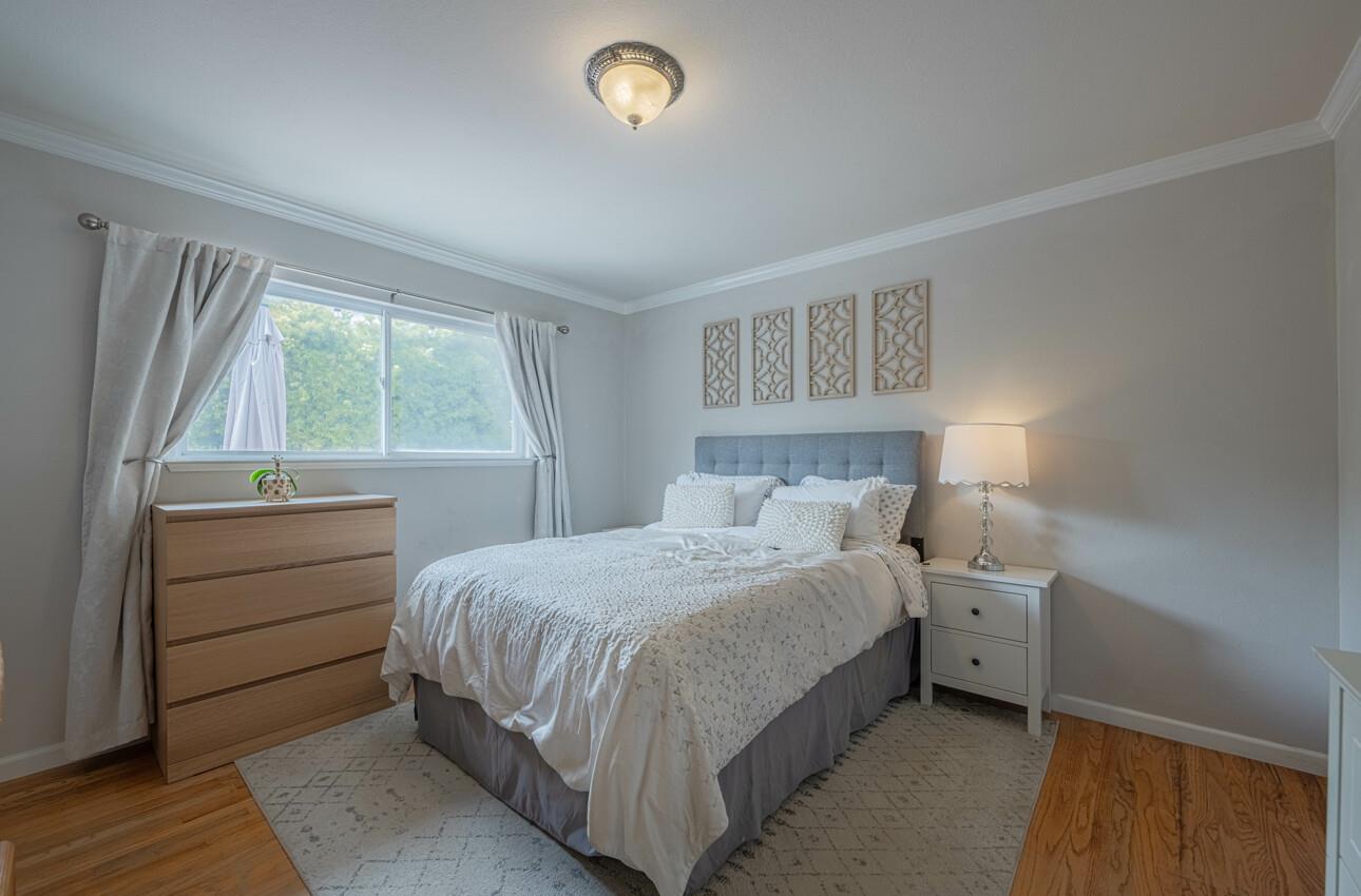 715 Vía Maria Salinas, CA 93901 - Photo 7 of 14 a bedroom with a bed and a window
