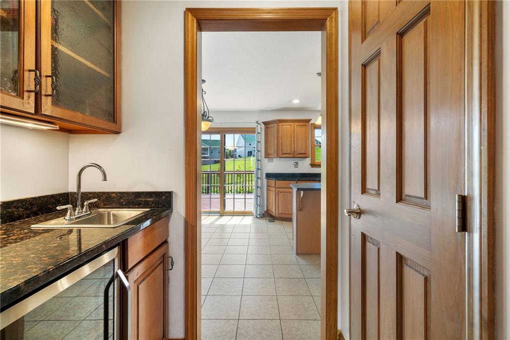 543 Birch Drive Houston, PA 15342 - Photo 12 of 48 a kitchen with granite countertop a sink and a stove