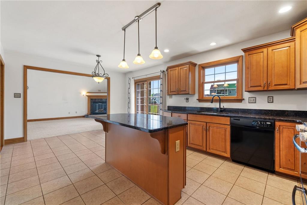 543 Birch Drive Houston, PA 15342 - Photo 16 of 48 a kitchen with granite countertop a stove a sink and a microwave