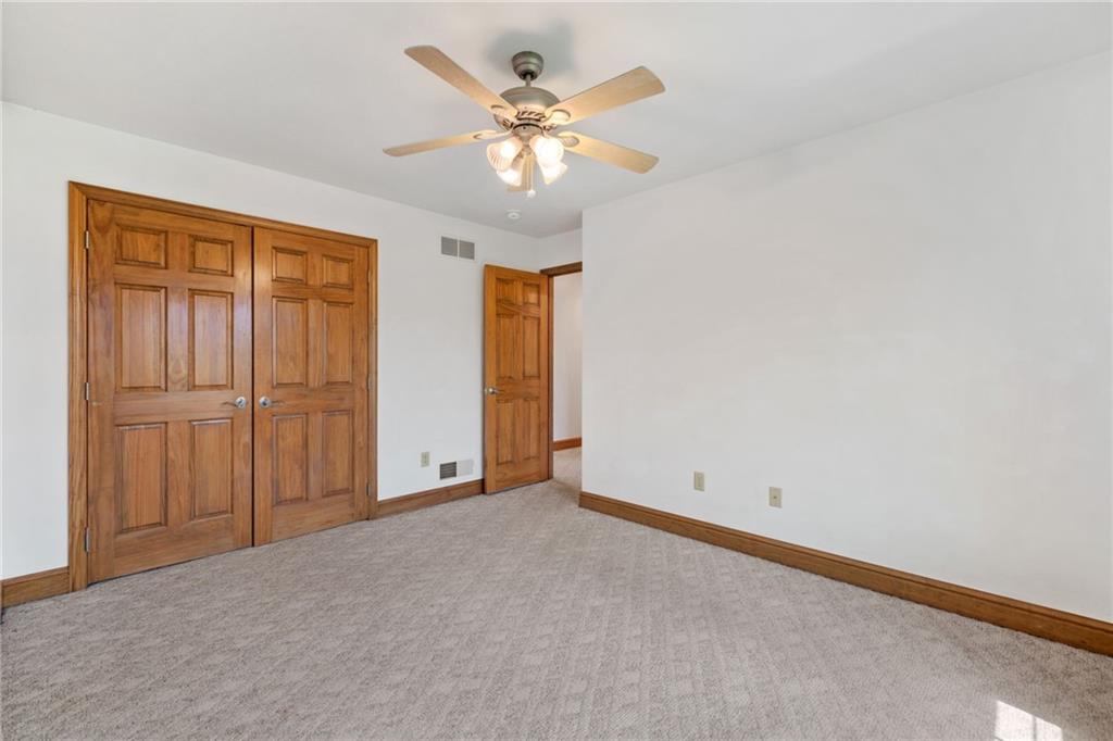 543 Birch Drive Houston, PA 15342 - Photo 32 of 48 an empty room with chandelier fan and windows