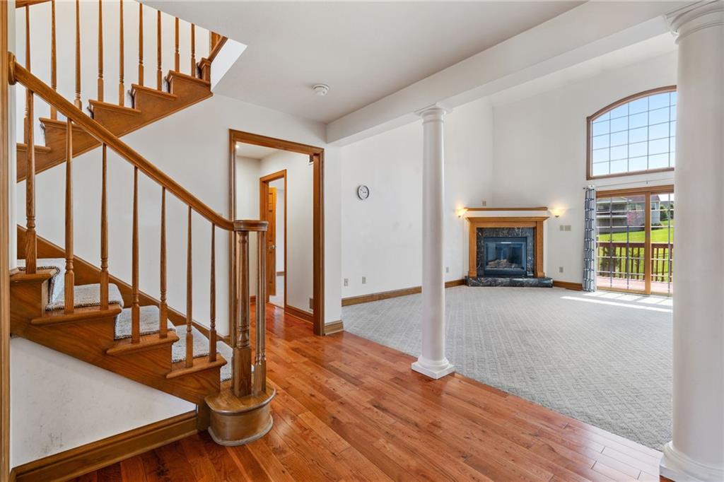 543 Birch Drive Houston, PA 15342 - Photo 5 of 48 a view of an entryway with wooden floor and a fireplace