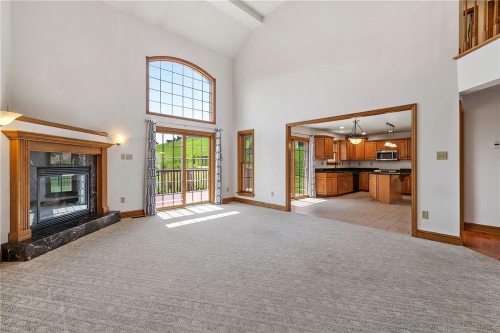 543 Birch Drive Houston, PA 15342 - Photo 8 of 48 a view of an empty room with a fireplace and a window