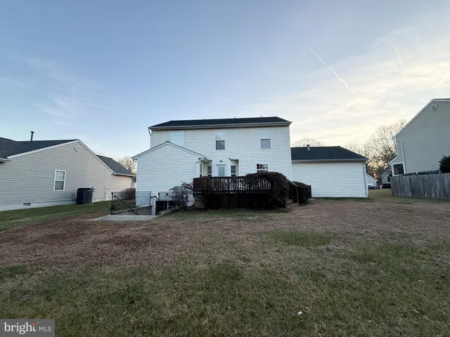 a view of a house with a back yard
