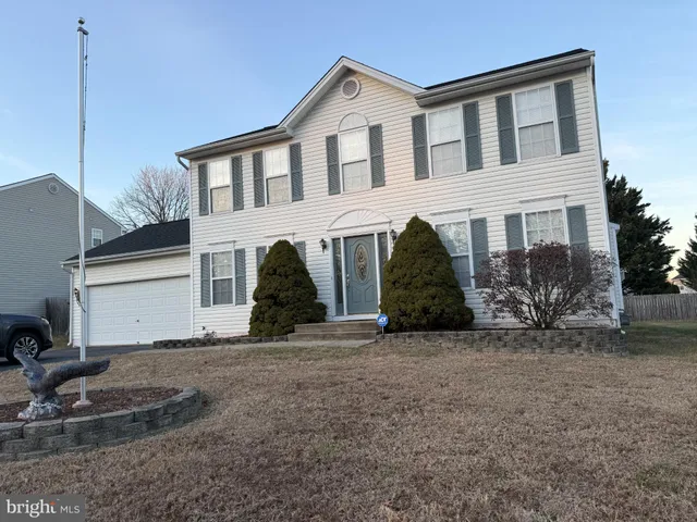 a front view of a house with garage