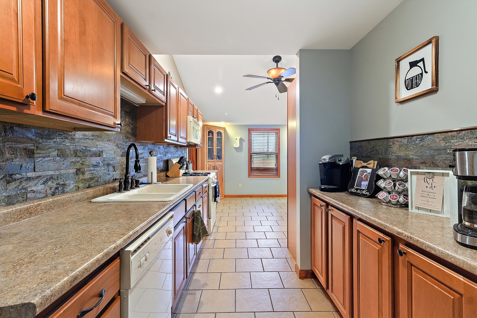 3100 Sportsman Club Road Bourbonnais, IL 60914 - Photo 8 of 15 a kitchen with stainless steel appliances granite countertop a sink stove and cabinets
