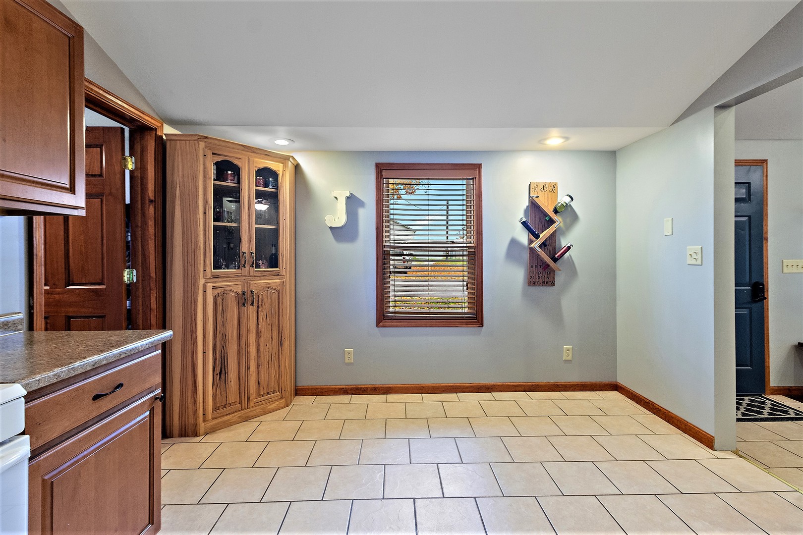 3100 Sportsman Club Road Bourbonnais, IL 60914 - Photo 9 of 15 a view of a kitchen with a sink and an empty room