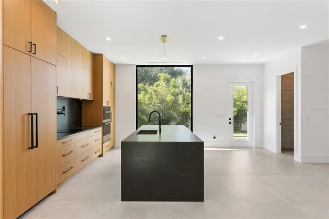 a view of a kitchen with furniture and a window