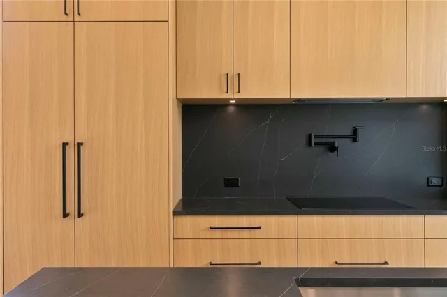 a view of an empty room with a ceiling fan