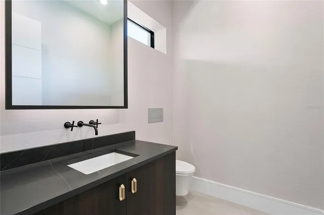 a spacious bathroom with a double vanity sink a mirror and a shower