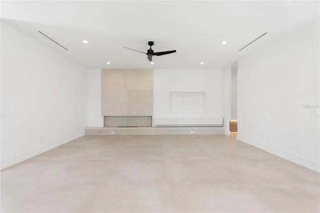 a view of kitchen with stainless steel appliances granite countertop a stove and a refrigerator