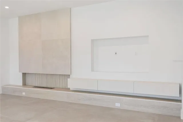 a large kitchen with stainless steel appliances granite countertop a large counter top a stove and a refrigerator