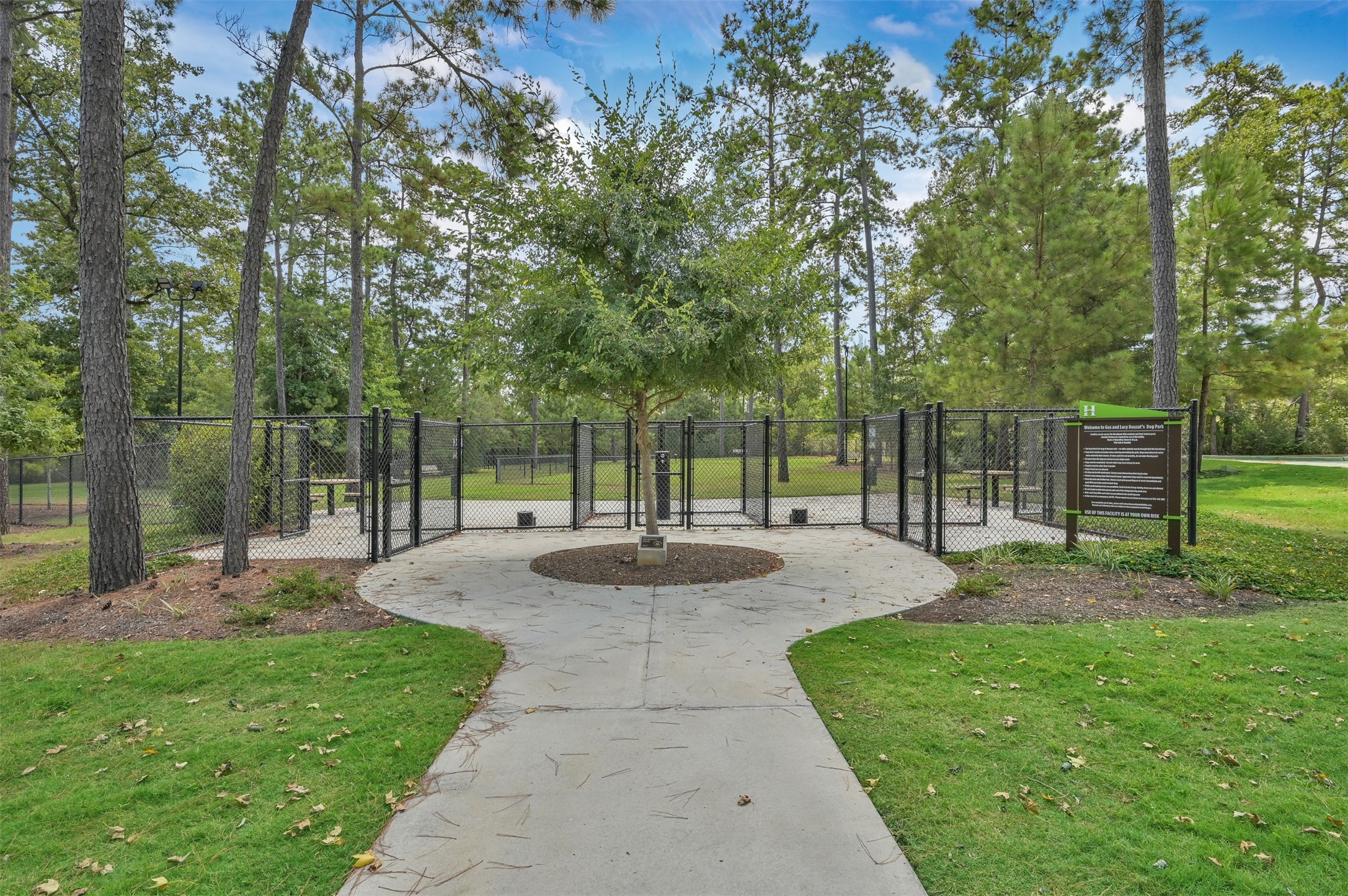 111 Yellow Perch Way Conroe, TX 77318 - Photo 33 of 35 Two dedicated dog parks offering plenty of space to play, along with watering stations and convenient pet cleanup areas.