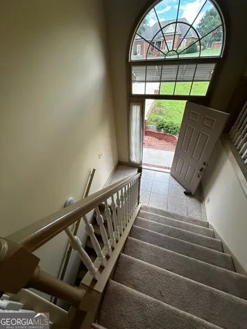 a view of staircase with large window