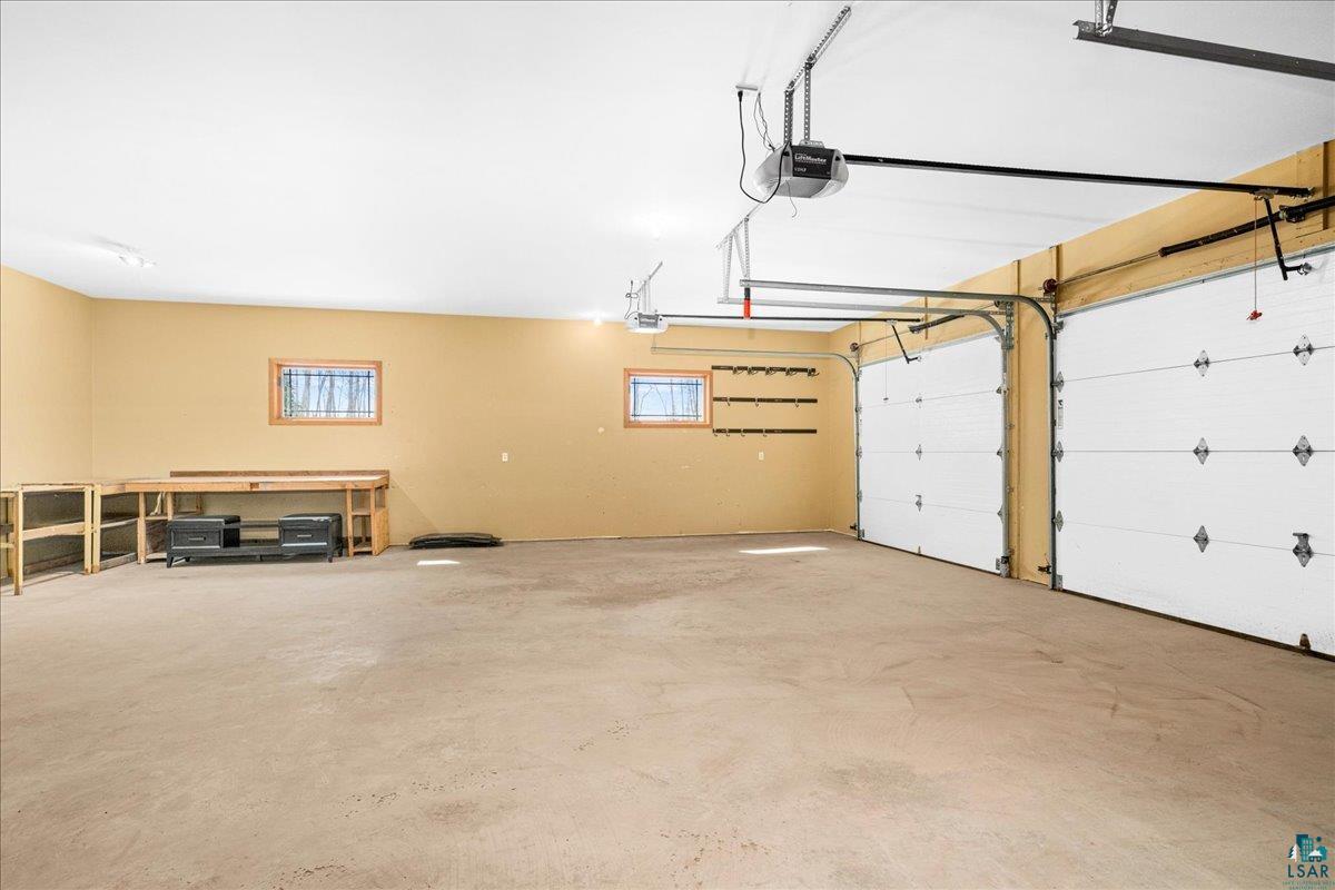 92598 Spells Road Sturgeon Lake, MN 55783 - Photo 41 of 60 Garage featuring a garage door opener
