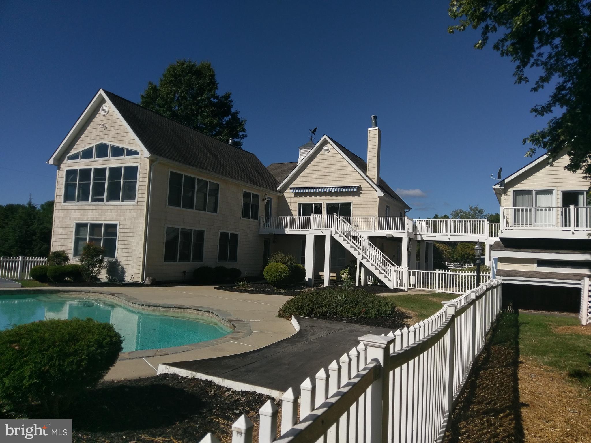 104 Thompson Road Chester, MD 21619 - Photo 2 of 29 Walk out to enjoy the private pool and sundeck )