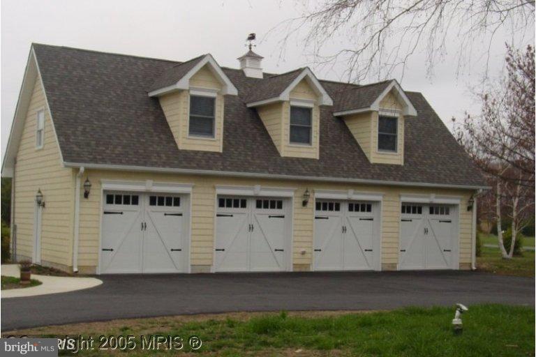 104 Thompson Road Chester, MD 21619 - Photo 4 of 29 Detached 4 car garage for the car collector