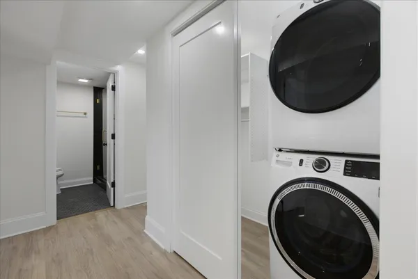 a view of a hallway with washer and dryer