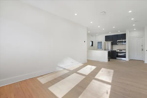 a view of kitchen and wooden floor