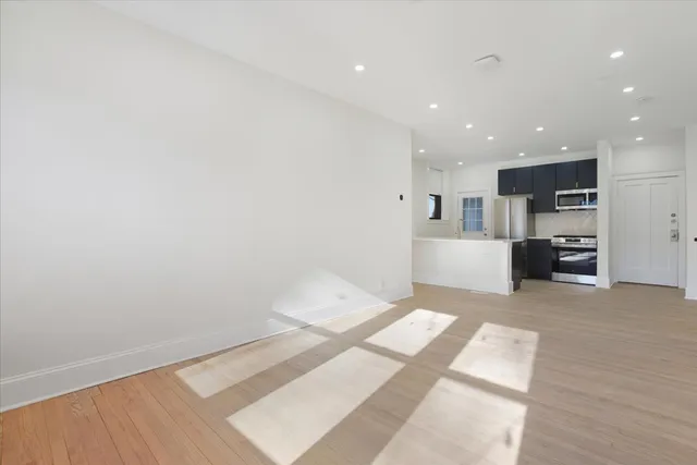 a view of kitchen and wooden floor