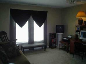 2081 Chapel Creek Road Concord, NC 28025 - Photo 3 of 8 a living room with furniture and a fireplace