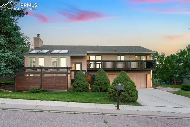 front view of a house with a garden