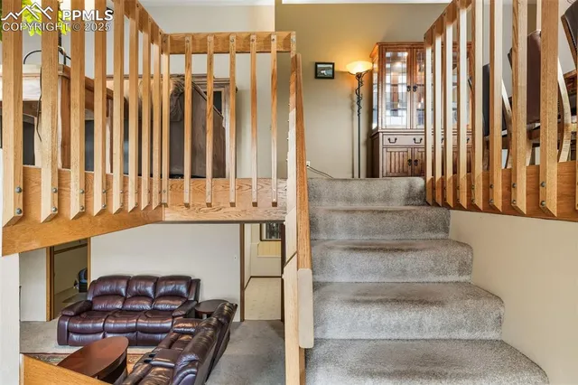 a view of staircase with white walls