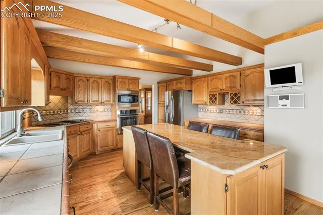 a kitchen with a table and chairs in it
