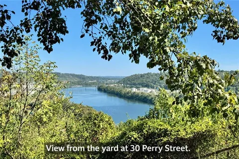 a view of a lake with houses in the back