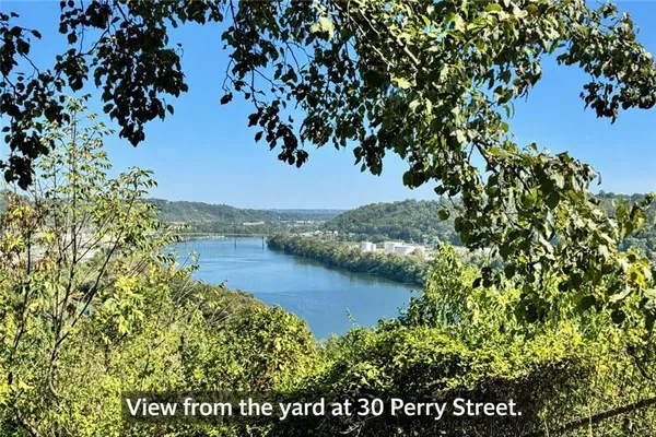a view of a lake with houses in the back