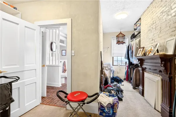 a view of a storage and utility room with a washer and dryer