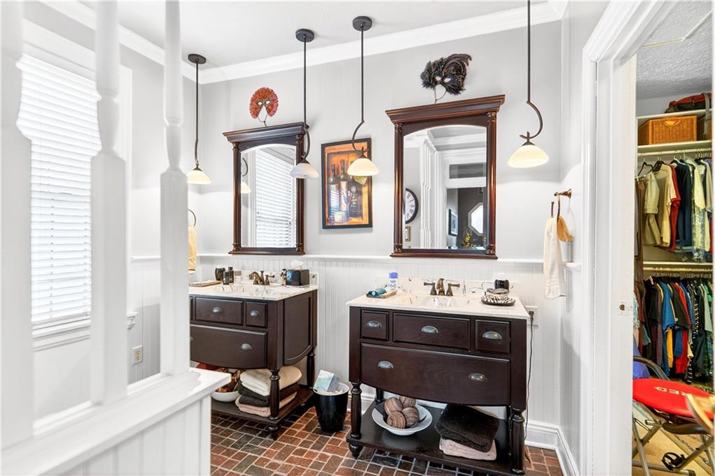 30 Perry Street Pittsburgh, PA 15209 - Photo 31 of 43 Dual Vanities with pendent lighting, wainscoting, ceramic tile flooring.