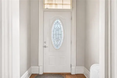 a view of entryway with wooden floor