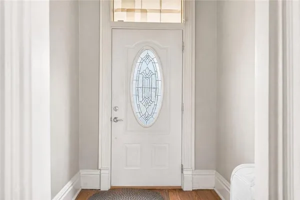 a view of entryway with wooden floor