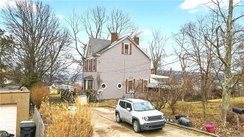 a car parked in front of a house