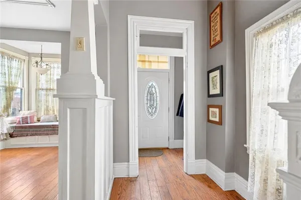 a view of front door with wooden floor