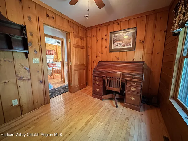 a bedroom with furniture and window