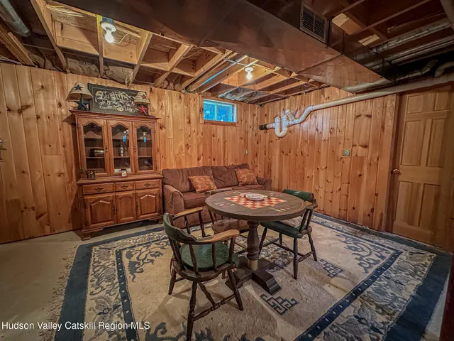 a view of a backyard with table and chairs with wooden floor
