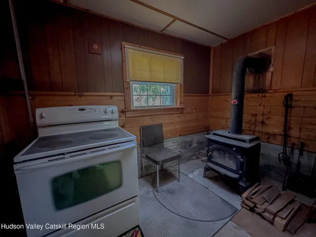 a stove top oven sitting inside of a kitchen