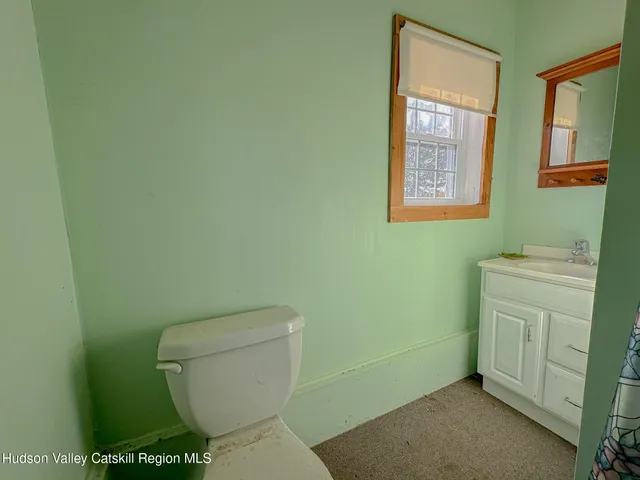 a bathroom with a toilet and a sink