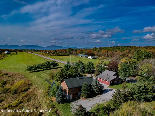 an aerial view of a house with a lake view