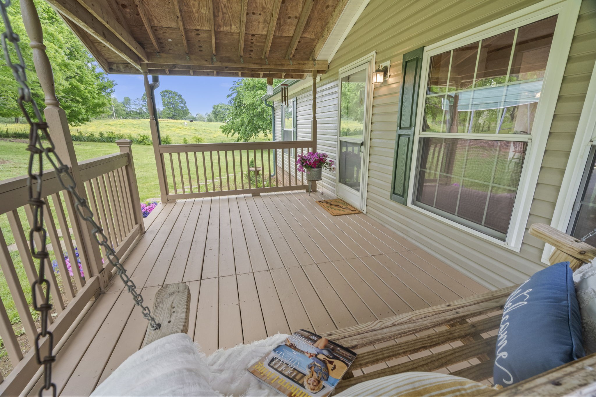 4012 Armstrong Road Springfield, TN 37172 - Photo 3 of 39 a view of a balcony with floor to ceiling windows with wooden floor