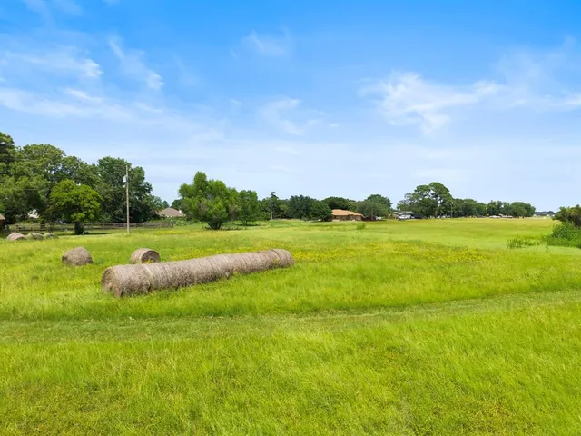 a view of a golf course with a lake view