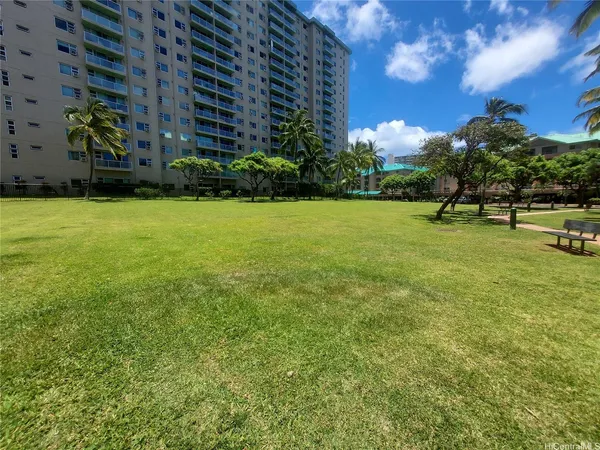 a view of a golf course with a house