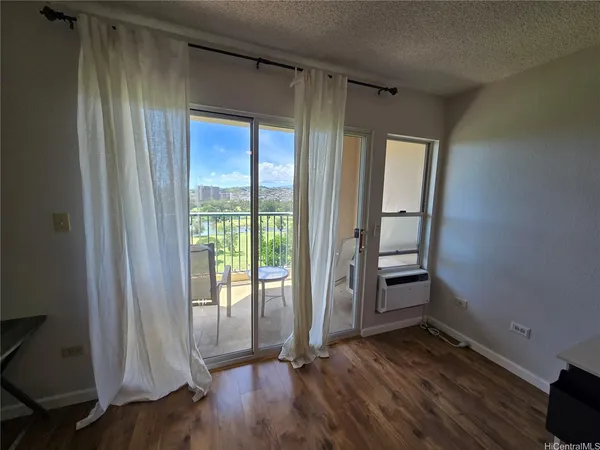 a view of front door with wooden floor