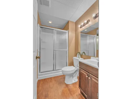 a bathroom with a toilet sink and a mirror