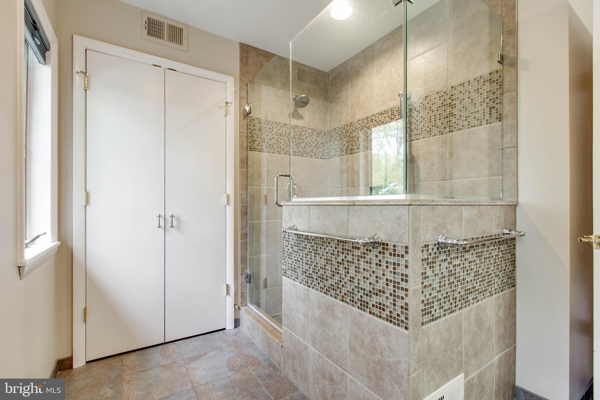 5519 Woodbine Road Sykesville, MD 21784 - Photo 28 of 69 a bathroom with a shower and a glass door